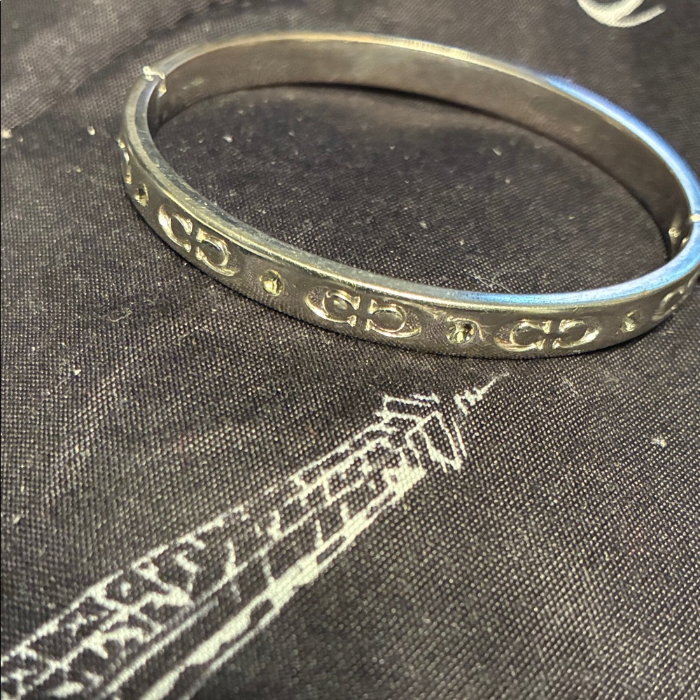 Silver Hoop Coach Bangle Bracelet with Repeating Logo Detail